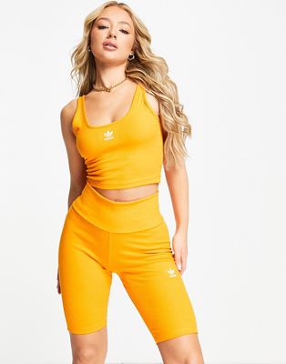 adidas Originals essential legging shorts with logo in orange