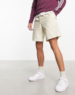 adidas Originals Monogram all-over print shorts in beige-Neutral