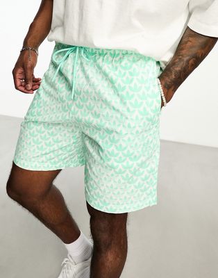 adidas Originals Monogram AOP shorts in green
