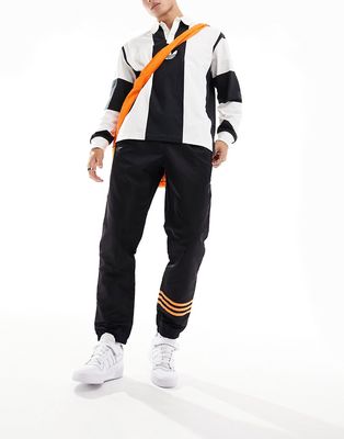 adidas Originals Neuclassics joggers in black and orange