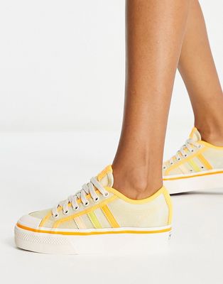 adidas Originals Nizza platform sneakers in almost yellow