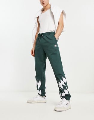 adidas Originals Rekive sweatpants in dark green and white