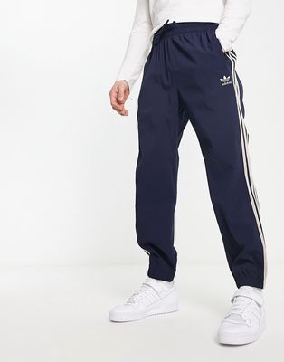 adidas Originals SPRT three stripe sweatpants in navy