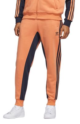 adidas Originals SST Fleece Track Pants in Hazy Copper/Legend Ink