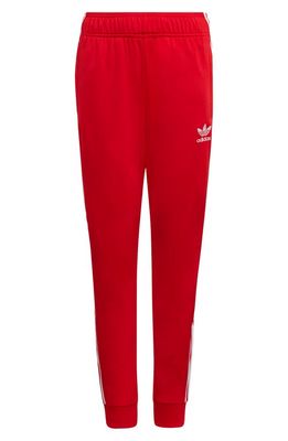 adidas Originals SST TRACK PANTS in Vivid Red/White