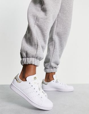 adidas Originals Stan Smith sneakers in off white with animal print heel tab