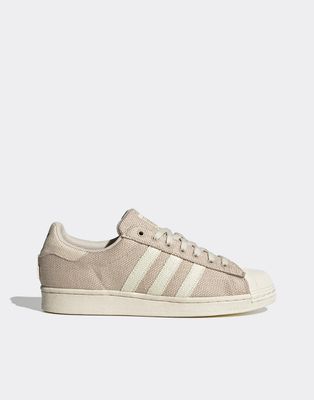 adidas Originals Superstar canvas sneakers in beige and white