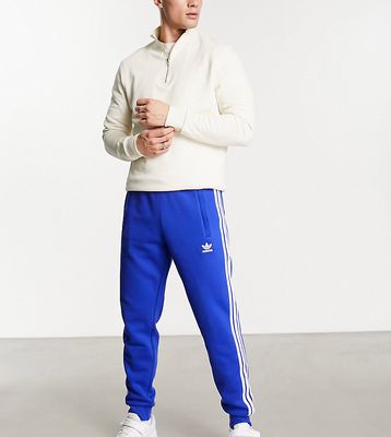 adidas Originals tall 3-Stripes sweatpants in blue