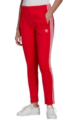 adidas Primeblue Superstar Track Pants in Vivid Red