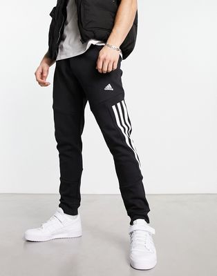 adidas Sportswear Future Icons 3 stripe sweatpants in black