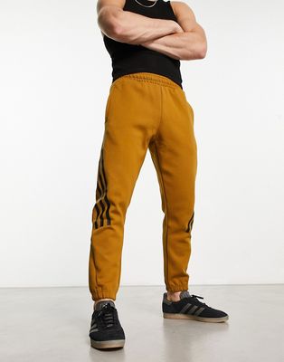 adidas Sportswear Future Icons 3 stripes sweatpants in dark orange-Brown