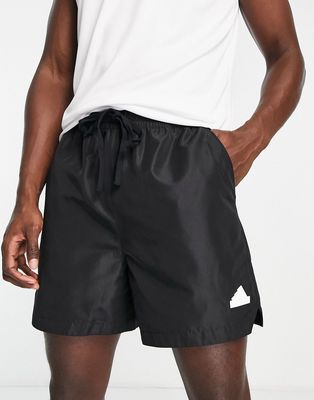 adidas Sportswear Future Lounge rubber logo shorts in black
