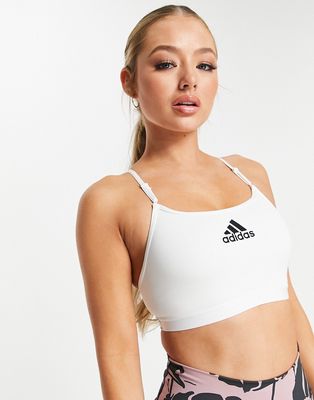 adidas Training Badge of Sport logo light-support sports bra in white