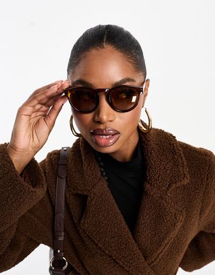 AIRE cursa round sunglasses in transparent brown