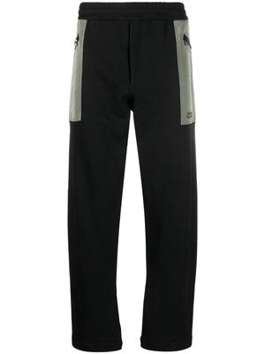 Alexander McQueen contrast-pocket cotton track pants - Black