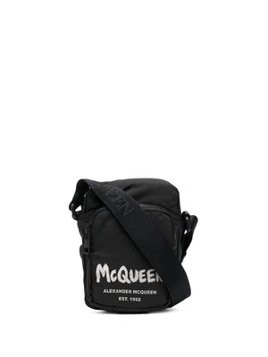 Alexander McQueen graffiti logo-print messenger bag - Black