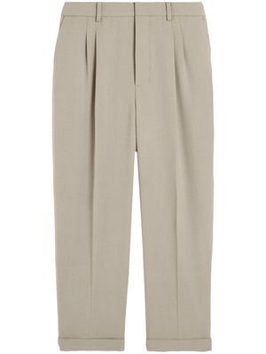 AMI Paris pressed-crease pleated tapered trousers - Neutrals