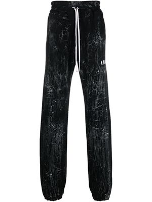 AMIRI cracked-dye logo track pants - Black
