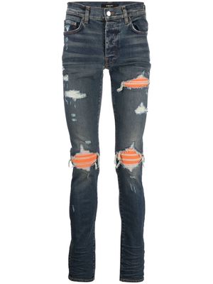 AMIRI distressed panelled skinny jeans - Blue
