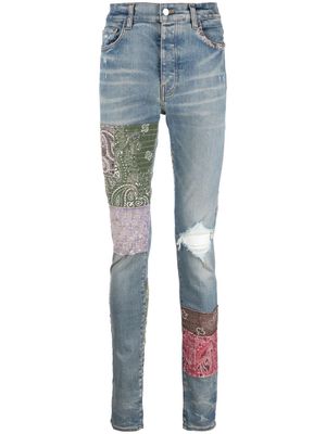 AMIRI distressed patchwork skinny jeans - Blue