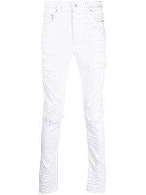 AMIRI distressed skinny-cut jeans - White