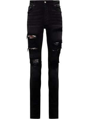 AMIRI Hibiscus art patch skinny jeans - Black