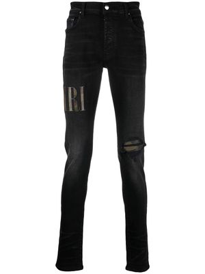AMIRI leather logo-patch skinny jeans - Black