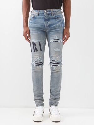 Amiri - Logo-appliqué Distressed Slim-leg Jeans - Mens - Blue