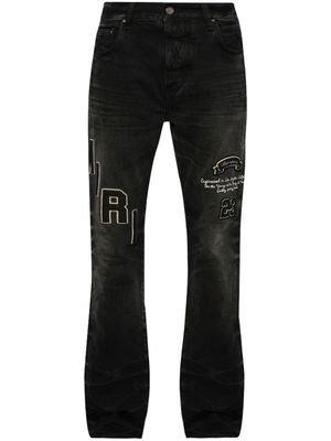 AMIRI logo-patch distressed jeans - Black