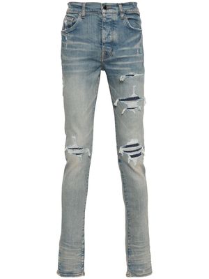 AMIRI logo-patch ripped skinny jeans - Blue