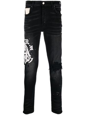 AMIRI logo-print distressed straight-leg jeans - Black