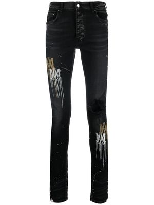 AMIRI paint splatter-blend skinny-cut jeans - Black