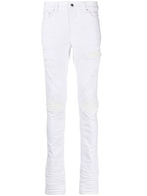 AMIRI ripped-detail slim-cut jeans - White