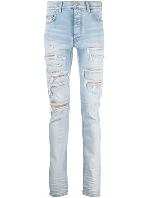 AMIRI Thrasher distressed skinny jeans - Blue