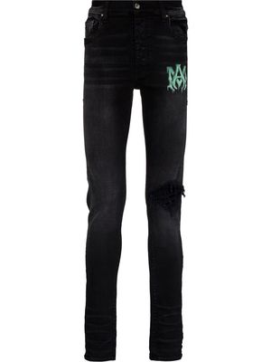 AMIRI Watercolour logo-print skinny jeans - Black