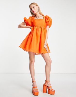 Amy Lynn mini organza smock dress with bow back and puff sleeves in orange-Brown