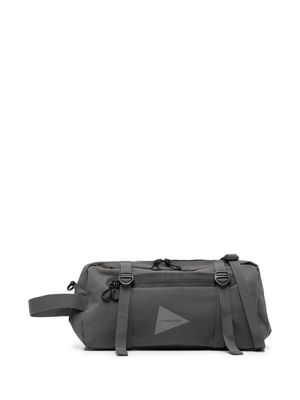 and Wander Pe/Co logo-print messenger bag - Grey