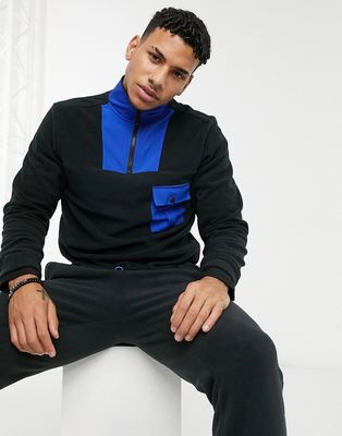 Another Infleunce fleece high neck quarter zip with mixed panels in black and blue