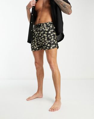 Another Influence swim shorts in black palm tree print