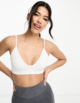 ASOS 4505 Icon seamless active intimate light support sports bra in white