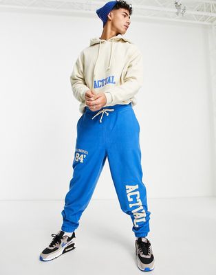 ASOS Actual relaxed sweatpants in polar fleece with logo prints in bright blue - part of a set-Blues