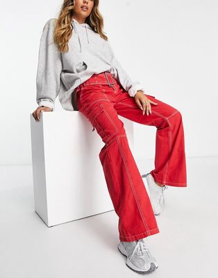 ASOS DESIGN belted cargo flare pants in red