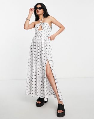 ASOS DESIGN broderie tiered maxi dress with halter cut out in white with black contrast