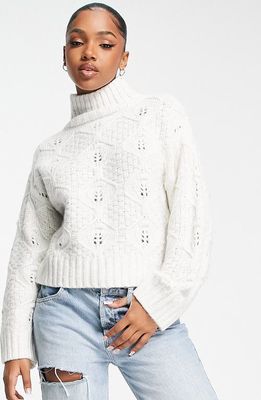 ASOS DESIGN Cable Stitch Turtleneck Sweater in Cream
