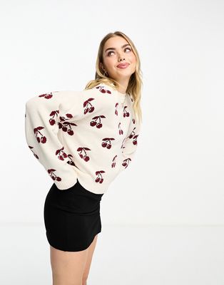 ASOS DESIGN cherry knit long sleeve sweater in ivory-White
