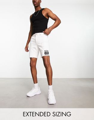 ASOS DESIGN classic rigid shorts in white with varsity print