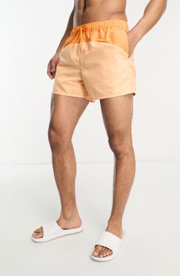 ASOS DESIGN Colorblock Short Swim Trunks in Orange