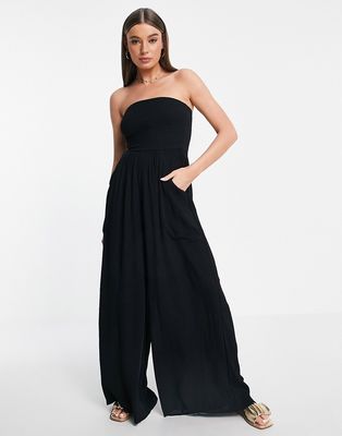 ASOS DESIGN crinkle rayon strapless slouch jumpsuit in black