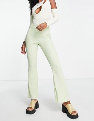 ASOS DESIGN crinkle texture flare pants in green