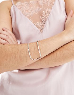 ASOS DESIGN cuff bracelet with cut out design in silver tone